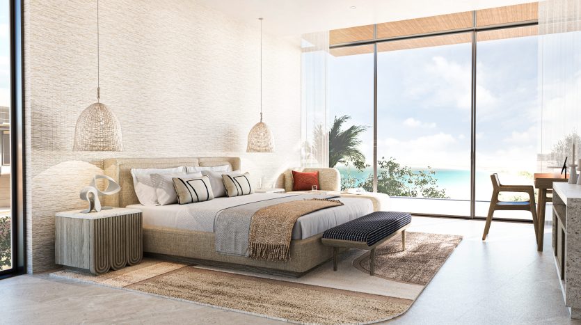 Une chambre luxueuse dans une villa à Dubaï avec un grand lit, un mobilier moderne et des baies vitrées offrant une vue sur une plage ensoleillée. La lumière naturelle remplit l'espace, accentuant le neutre