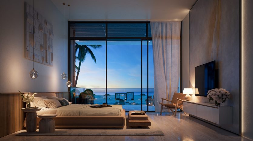 Une chambre moderne dans une villa de Dubaï au crépuscule, dotée d'un grand lit, d'un mobilier minimaliste et de baies vitrées offrant une vue sur une plage tranquille et l'océan sous un ciel décoloré.