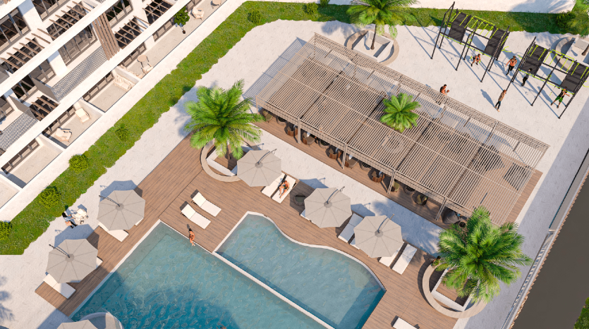 Vue aérienne d&#039;une villa de luxe à Dubaï comprenant une piscine rectangulaire, des chaises longues sous des parasols, un pavillon, une zone herbeuse avec des palmiers et un jeu d&#039;eau ludique, entourée de