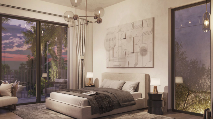 Une chambre moderne dans une villa de Dubaï comprenant un grand lit avec une literie neutre, une œuvre d&#039;art abstraite au mur, un éclairage contemporain et une vue panoramique sur les palmiers à travers des portes coulissantes en verre au crépuscule.