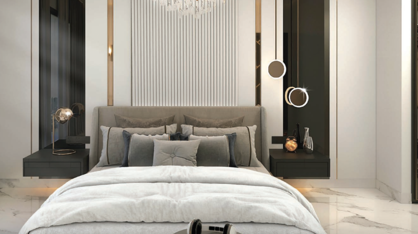 Une chambre luxueuse et moderne dans un appartement de Dubaï comprenant un lit moelleux avec une literie grise, un sol en marbre, des tables d'appoint en miroir et d'élégants panneaux muraux avec des lampes murales circulaires.