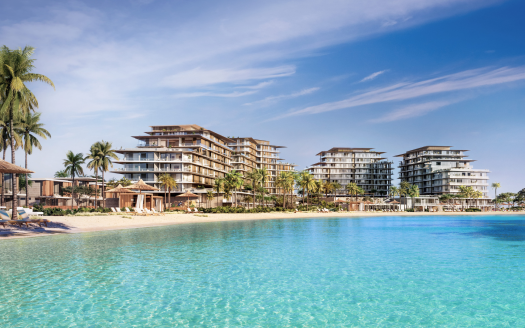 Luxueux complexe hôtelier en bord de mer avec plusieurs bâtiments modernes entourés de palmiers, surplombant une grande piscine turquoise sous un ciel bleu clair, représentant une opportunité immobilière de premier ordre à Dubaï.