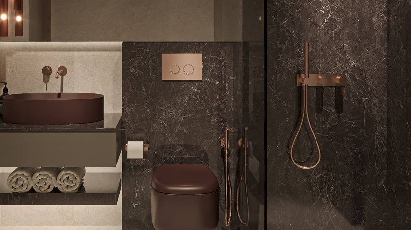 Une salle de bains luxueuse dotée d&#039;un mur en marbre foncé avec un lavabo rond de couleur cuivre, une serviette assortie et un robinet. Des serviettes blanches soigneusement empilées et des luminaires modernes améliorent l&#039;ambiance de cette villa de Dubaï.