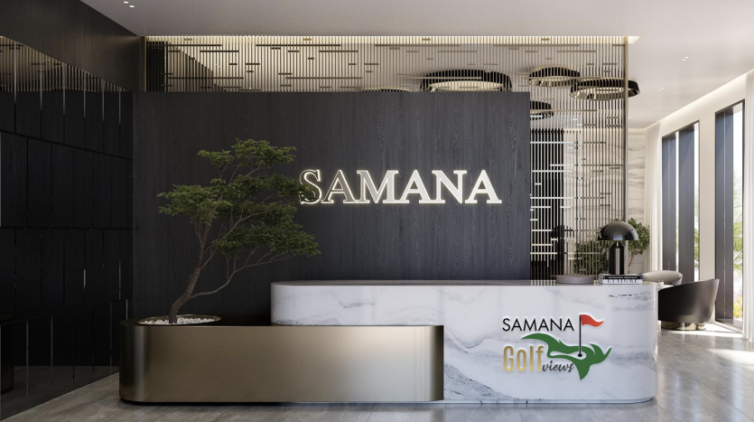 Hall de bureau moderne comprenant un bureau de réception noir et blanc étiqueté « samana » et un logo, avec un grand bonsaï à côté, à l'intérieur d'un espace élégant au carrelage noir avec des accents dorés.