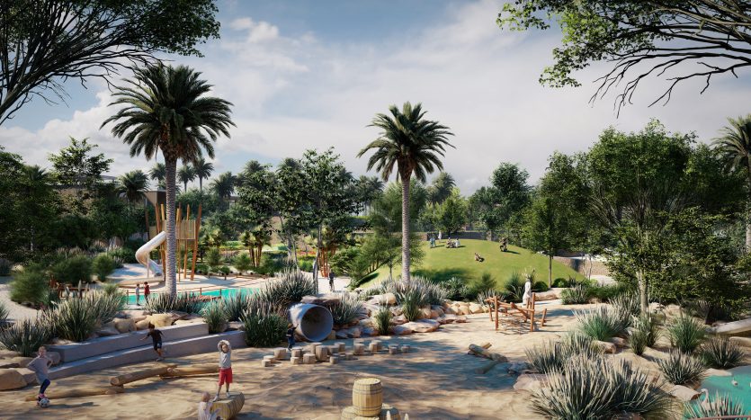 Un parc luxuriant avec des palmiers, un toboggan aquatique et une aire de jeux sablonneuse. L&#039;environnement serein comprend un sentier pédestre et des bancs à l&#039;ombre des arbres, parfaits pour ceux qui envisagent d&#039;investir à Dubaï.