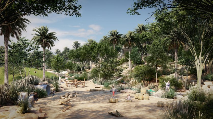Un parc animé avec de grands palmiers, des allées sablonneuses et des gens profitant tranquillement du plein air au milieu d&#039;une verdure luxuriante et de coins salons dispersés à proximité des luxueuses villas de Dubaï.