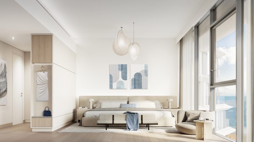Une chambre moderne et lumineuse dans un appartement de Dubaï avec de grandes fenêtres donnant sur la mer, un lit double, des suspensions élégantes, un mobilier minimaliste et des touches de bleu doux.