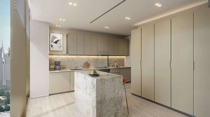 Une cuisine moderne avec des armoires élégantes, un îlot en marbre et des appareils électroménagers intégrés. Les tons neutres et l&#039;éclairage lumineux créent un espace élégant dans cette villa de Dubaï.