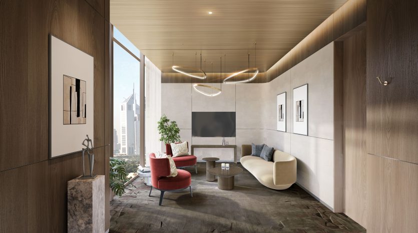 Un salon moderne dans un appartement de Dubaï avec des murs en bois élégants, un canapé crème, un fauteuil rouge et des luminaires élégants. Des œuvres d&#039;art sont accrochées aux murs et il y a une vue sur
