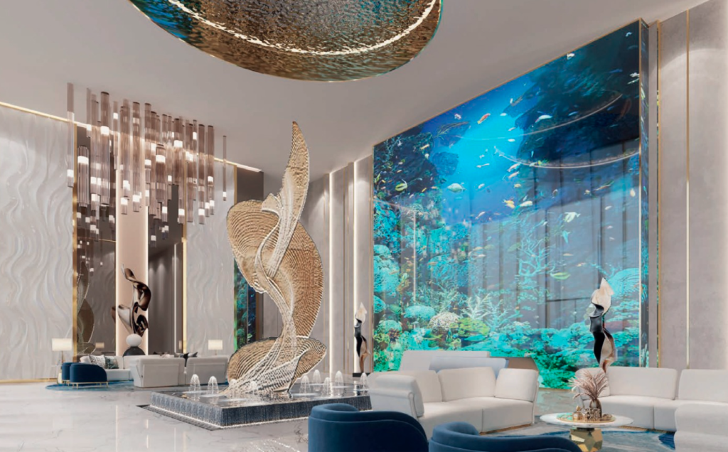 Un hall luxueux dans une villa de Dubaï avec des sols en marbre, avec un grand aquarium rempli de poissons d&#039;un côté, une sculpture en spirale unique au centre et des coins salons luxueux.
