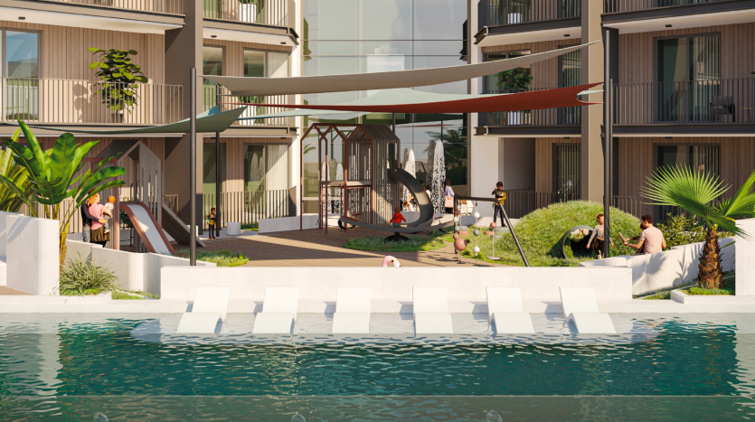 Un complexe d&#039;appartements moderne à Dubaï dont les résidents bénéficient d&#039;équipements tels qu&#039;une aire de jeux, un coin salon ombragé au bord d&#039;une piscine réfléchissante, une verdure luxuriante et des balcons.