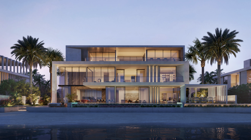Une villa de luxe moderne à Dubaï au crépuscule, dotée de grandes fenêtres en verre et de plusieurs balcons, entourée de palmiers et d'un bassin réfléchissant tranquille.