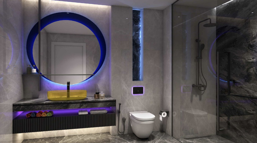 Intérieur de salle de bains moderne dans une villa de Dubaï comprenant un miroir circulaire avec éclairage LED bleu, un lavabo jaune sur une vanité sombre, des murs en marbre, une douche à porte vitrée et des toilettes murales. Faiblement éclairé