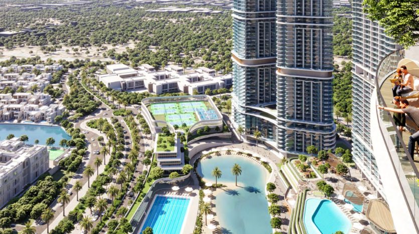 Vue aérienne d&#039;une zone urbaine luxueuse de Dubaï avec des immeubles modernes de grande hauteur, plusieurs piscines, des espaces verts luxuriants et des courts de tennis, le tout dans un environnement paysager ensoleillé.