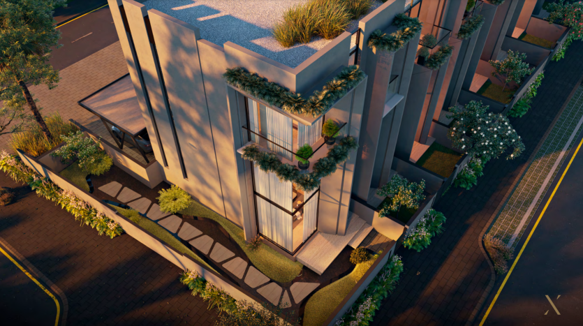 Un rendu architectural d&#039;un bâtiment moderne au crépuscule à Dubaï, avec un éclairage extérieur mettant en valeur sa façade géométrique et sa verdure luxuriante.
