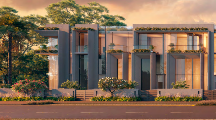 Maisons de ville modernes au design épuré et aux grandes fenêtres, chaque unité dispose d&#039;un balcon avec des plantes vertes, entouré de palmiers sous un doux coucher de soleil, parfait pour l&#039;immobilier Dubaï.