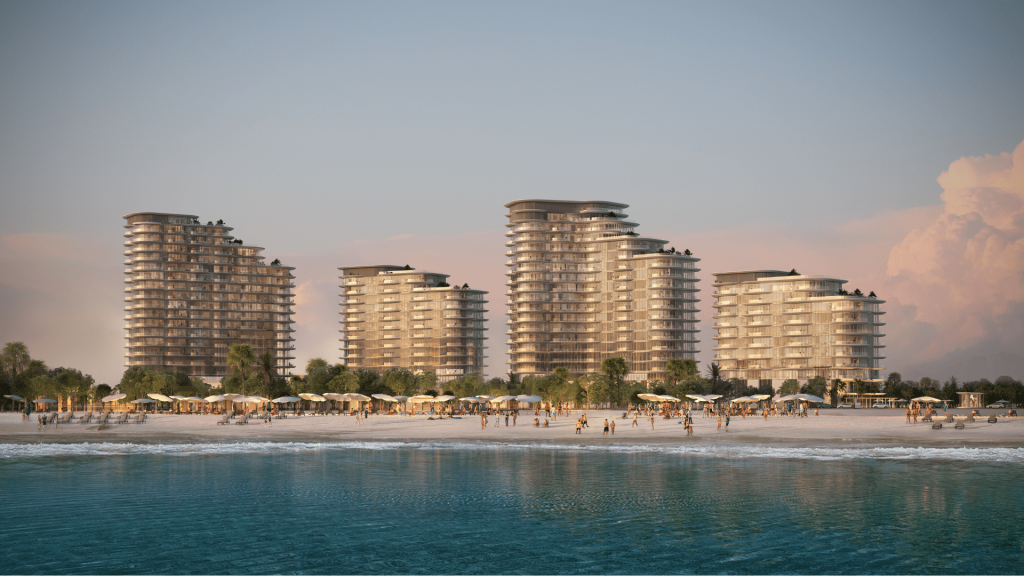 Condominiums modernes en bord de mer sous un ciel coucher de soleil à Dubaï, avec des gens profitant de la plage et de l&#039;océan au premier plan.