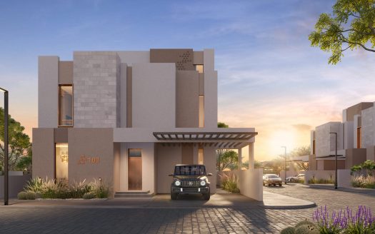 Une maison moderne avec un toit plat et une façade beige au coucher du soleil, située dans le quartier immobilier privilégié de Dubaï. Une voiture est garée sous l'allée couverte. Un aménagement paysager bien entretenu met en valeur