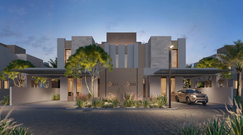 Immeuble résidentiel moderne à Dubaï au crépuscule avec une voiture garée sous l&#039;auvent d&#039;entrée, entouré de verdure paysagée et de palmiers.