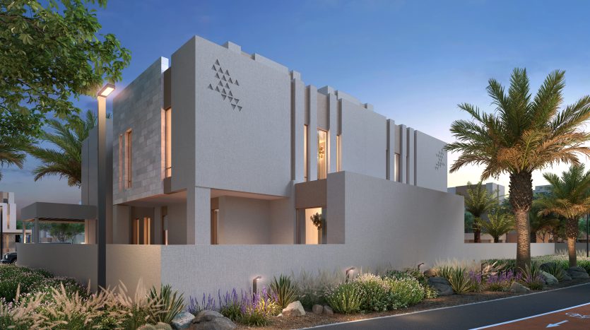 Bâtiment moderne de deux étages avec des détails de façade géométriques au crépuscule, entouré de palmiers et d&#039;un aménagement paysager luxuriant sous un ciel teinté de rose, parfait pour une vitrine d&#039;appartement à Dubaï.