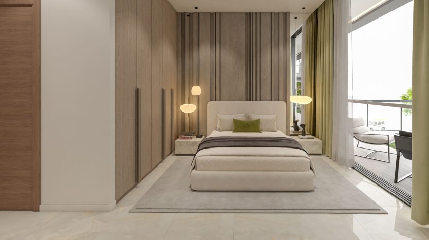Une chambre moderne dans un appartement de Dubaï comprenant un lit rembourré beige avec un banc assorti au pied, flanqué de deux lampes de table lumineuses. La pièce est agrémentée de murs en panneaux de bois, d&#039;un