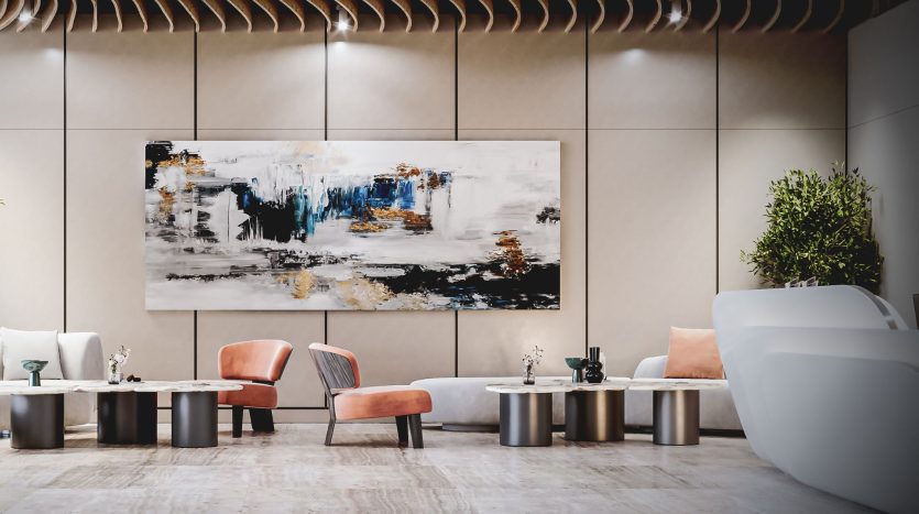 Un hall d'entrée moderne avec des sièges élégants, comprenant deux chaises saumon et un canapé blanc, complétant une grande peinture abstraite au mur, sous un éclairage chaleureux dans une luxueuse villa de Dubaï.