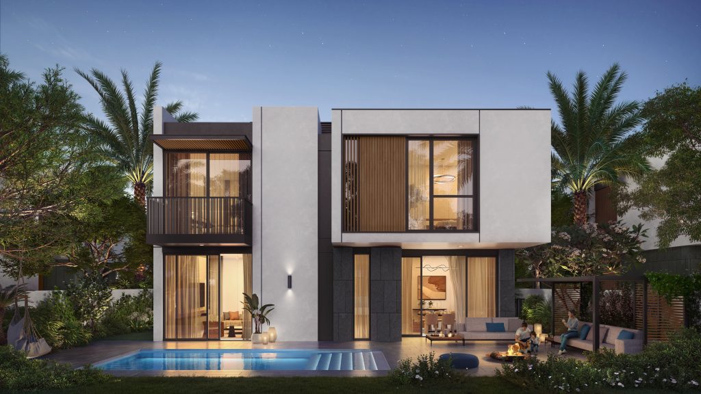Une maison moderne de deux étages à Dubaï au crépuscule, dotée de grandes fenêtres, d'une piscine et entourée d'une verdure luxuriante et de palmiers. La maison est éclairée par des lumières intérieures chaleureuses et des éclairages extérieurs au sol.