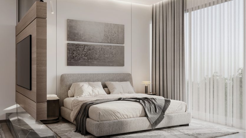 Une chambre moderne comprenant un grand lit avec une literie grise, un jeté douillet, deux peintures abstraites au-dessus du lit et un élégant meuble TV intégré en bois sombre à gauche, idéal pour tout investissement.