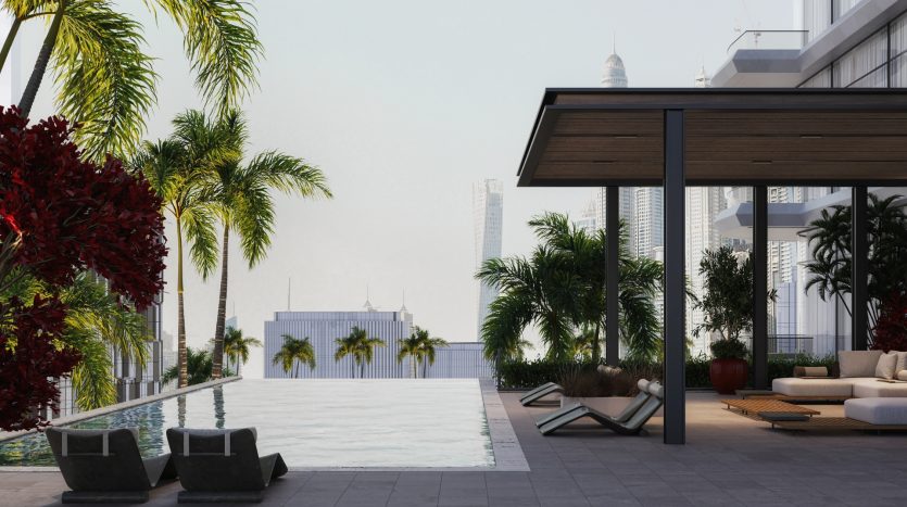Une piscine luxueuse sur le toit avec des chaises longues modernes, entourée de plantes tropicales luxuriantes et une vue sur les immeubles de grande hauteur à proximité, proposée par une agence immobilière d&#039;élite de Dubaï.