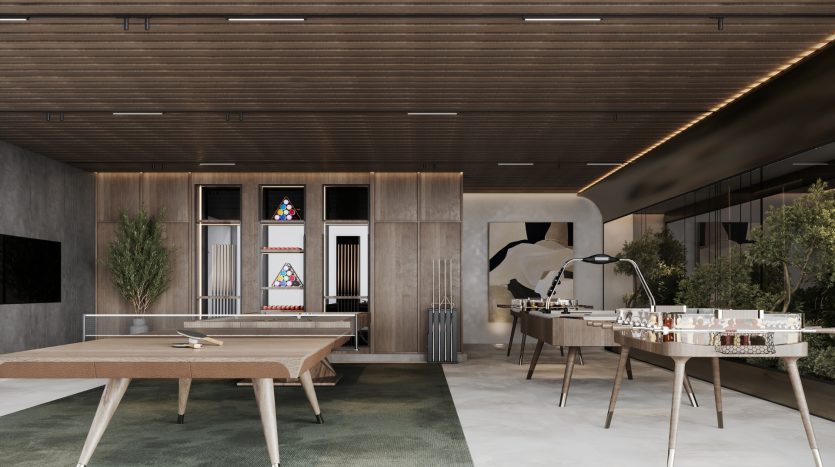 Espace de loisirs de bureau moderne avec une table de ping-pong, une table de baby-foot, un café-bar avec tabourets et un salon de relaxation dans le cadre d&#039;une villa de Dubaï, avec des accents en bois élégants et un design contemporain.