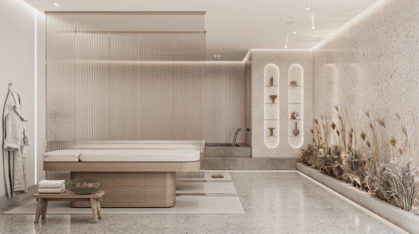 Une salle de bains moderne et luxueuse dans une villa à Dubaï avec une grande baignoire, un banc en bois et des murs texturés détaillés, intégrés à un éclairage ambiant et à de l&#039;herbe de pampa séchée décorative.