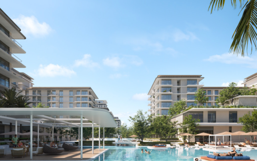 Un complexe luxueux composé de bâtiments modernes entourant une grande piscine avec des chaises longues et un espace ombragé, sur fond de ciel bleu clair et de verdure luxuriante, parfait pour ceux qui s'intéressent à l'immobilier Dubaï.