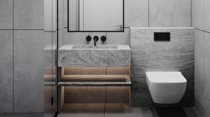 Salle de bains moderne dans une villa à Dubaï avec des éléments en marbre comprenant des toilettes murales, un meuble double vasque avec des accents en bois et un grand miroir. La palette de couleurs comprend des tons gris et noirs.