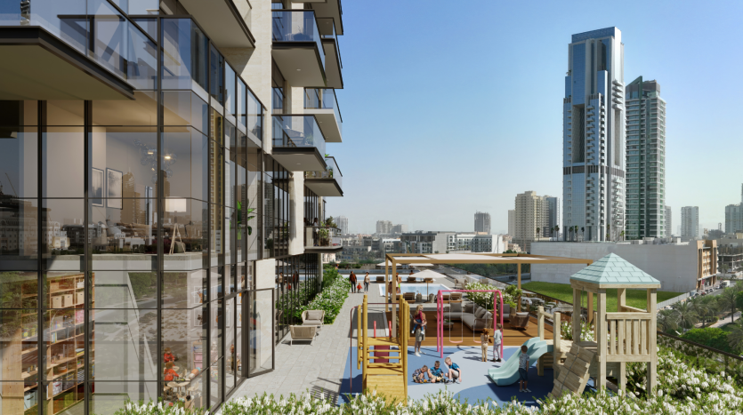 Balcon urbain moderne à Dubaï surplombant un paysage urbain avec des immeubles de grande hauteur. Dispose d'une aire de jeux avec toboggans et d'une terrasse dans le jardin, le tout sous un ciel bleu clair.