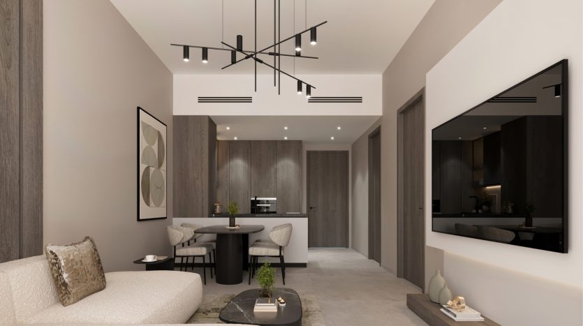 Intérieur d&#039;appartement moderne à Dubaï comprenant une cuisine élégante avec des armoires sombres, un salon confortable avec un mobilier neutre, des œuvres d&#039;art abstraites et un luminaire élégant.