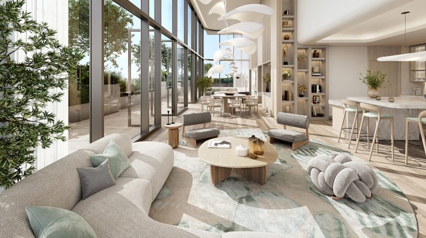 Un espace de vie moderne et spacieux dans un appartement de Dubaï avec de grandes fenêtres, de la lumière naturelle et une vue sur la verdure. Il dispose d&#039;un mobilier élégant, d&#039;un coin cuisine et d&#039;une décoration élégante.