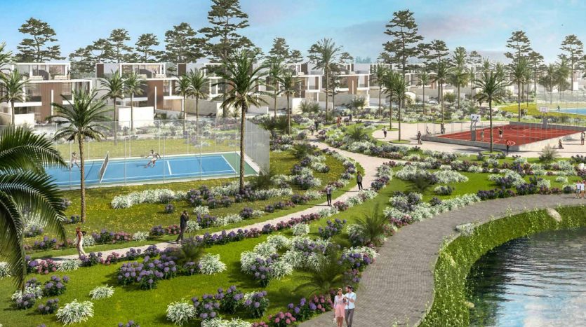 Communauté résidentielle luxuriante avec des villas modernes, des jardins paysagers, une rivière et des zones de loisirs comprenant des courts de tennis et des sentiers, sous un ciel dégagé à Dubaï.