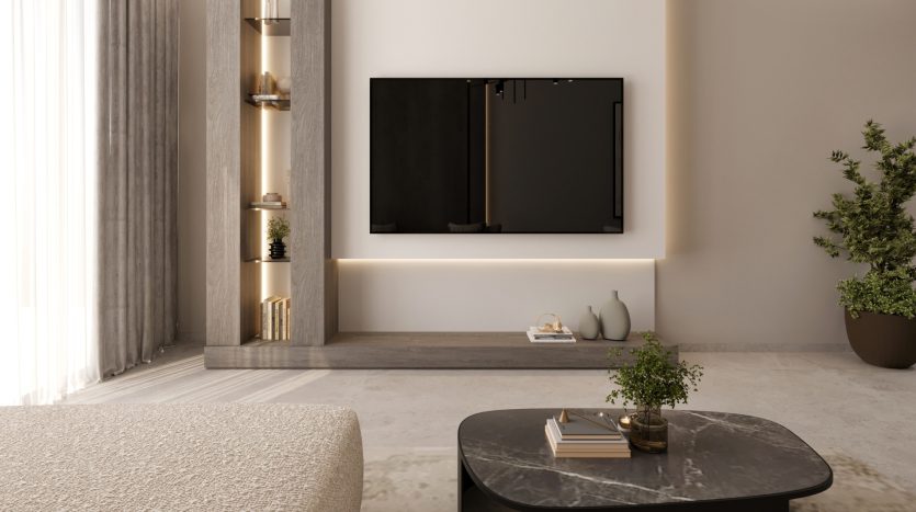 Un salon moderne dans un appartement de Dubaï comprenant une élégante télévision murale au-dessus d&#039;une console basse, accentuée par un éclairage ambiant et une décoration minimaliste, avec une table basse en marbre et un canapé confortable