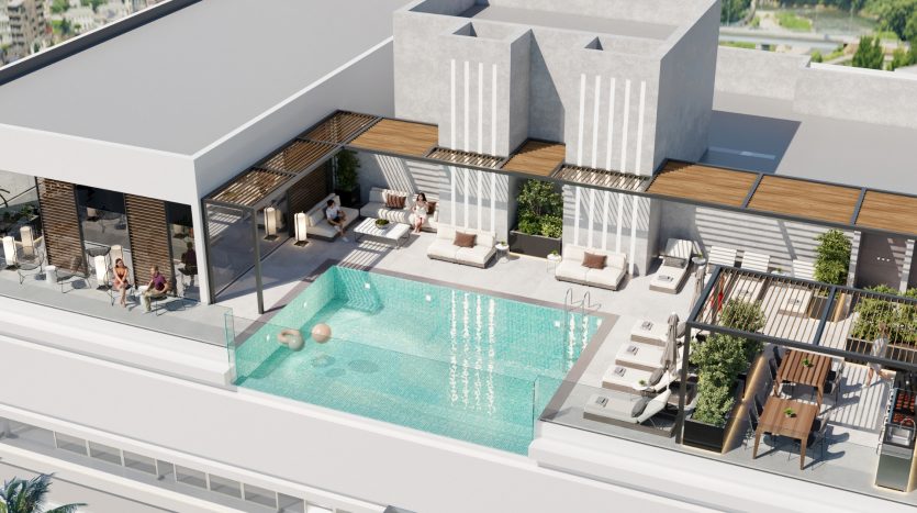 Cadre luxueux sur le toit avec une piscine étincelante entourée de salons modernes, de cabanes en bois, de plantes et de groupes dispersés de personnes profitant d&#039;une journée ensoleillée dans une villa de Dubaï.