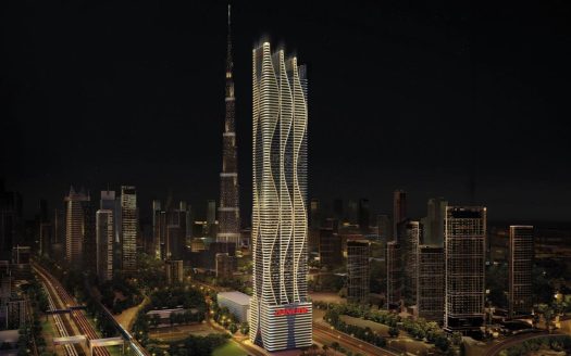Vue nocturne d&#039;un horizon de ville moderne avec un gratte-ciel illuminé au design unique qui se distingue des autres immeubles de grande hauteur à Dubaï.