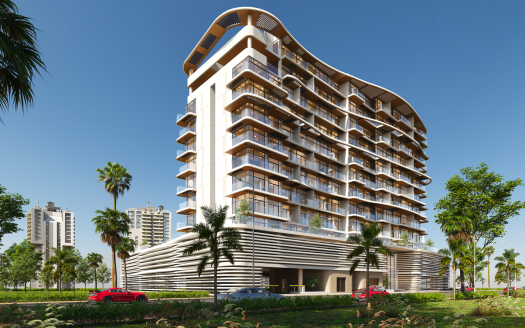 Bâtiment moderne de plusieurs étages avec des balcons incurvés et des rayures horizontales, entouré d'une verdure luxuriante et de palmiers, avec des voitures garées devant sous un ciel bleu clair, cette structure rappelle de manière unique une villa de Dubaï.