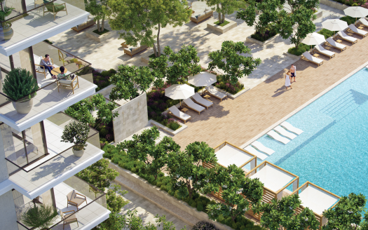 Une piscine extérieure luxueuse entourée de plantes et d&#039;arbres luxuriants, dotée de chaises longues, de tables ombragées et d&#039;une terrasse pour se promener. On voit des gens se détendre et se promener dans l’environnement serein d’une villa de premier ordre à Dubaï.