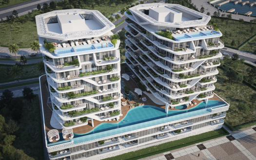 Vue aérienne de deux luxueuses villas à plusieurs étages à Dubaï avec piscines sur le toit, entourées d'une verdure luxuriante dans une région côtière.