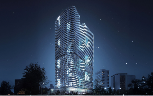 Un gratte-ciel futuriste à Dubaï illuminé la nuit avec un design présentant des façades incurvées et superposées sur un ciel étoilé, entouré d&#039;autres structures urbaines.