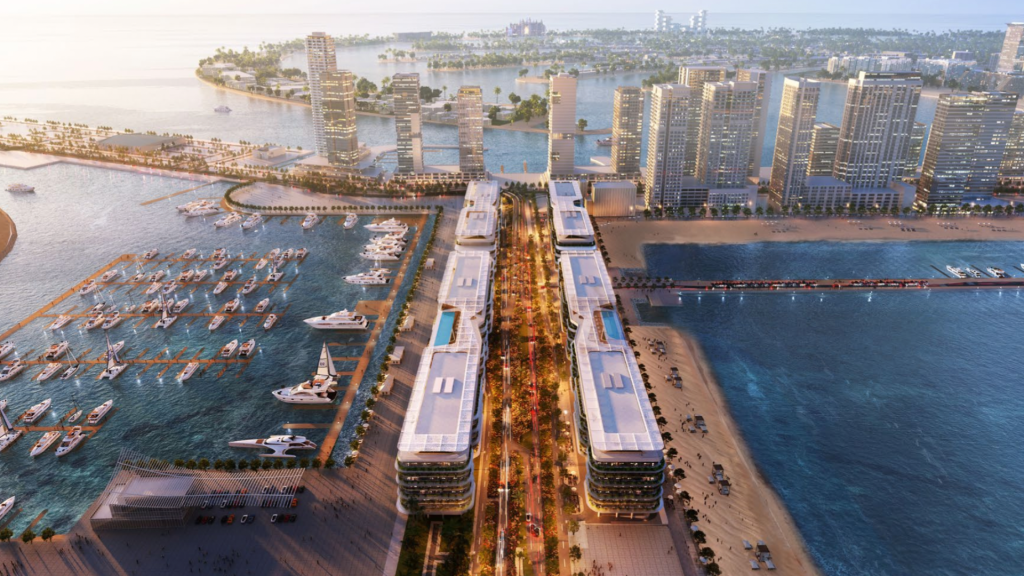 Vue aérienne d'un paysage urbain animé au bord de l'eau avec des immeubles de grande hauteur, une promenade bordée de palmiers et des marinas remplies de yachts. Une large avenue centrale éclairée s'étend entre deux bâtiments modernes et allongés en direction de la plage du port de Dubaï, un véritable programme d'exception.