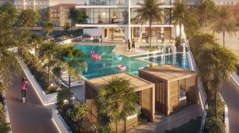 Piscine extérieure luxueuse avec cabanes, palmiers et grands flotteurs flamants roses, entourée d&#039;une villa résidentielle moderne de Dubaï au coucher du soleil.