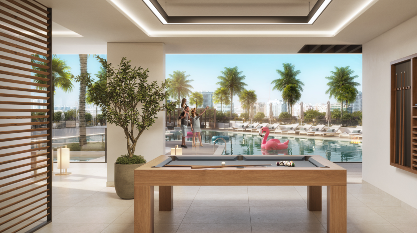 Espace luxueux au bord de la piscine dans une villa de Dubaï présentant un design moderne avec une verdure luxuriante, un fond de paysage urbain animé, une table de billard au premier plan et des personnes profitant d&#039;une journée ensoleillée.