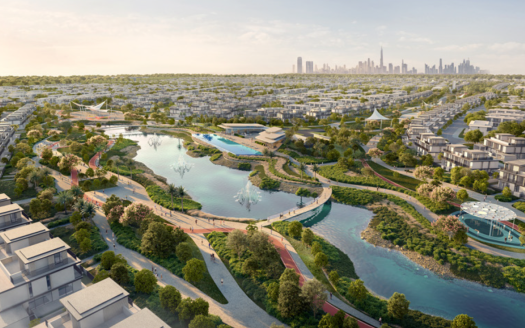 Vue aérienne de Dubaï Sud, une ville moderne avec un grand parc luxuriant au centre, doté de sentiers sinueux, d'espaces verts, d'étangs et de ponts. Autour du parc se trouvent de nombreux bâtiments résidentiels d'Emaar. L'horizon de la ville, parsemé de grands gratte-ciel, constitue la toile de fond de cette nouvelle communauté.