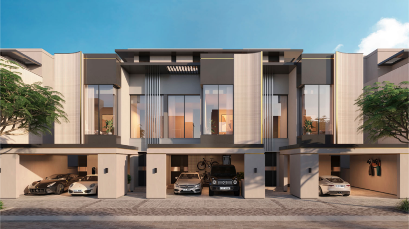 Le Watercrest Ellington est un complexe de maisons de ville moderne composé de trois logements, chacun doté de grandes fenêtres et de balcons. Au-dessous de chaque unité se trouvent des abris avec des véhicules de luxe garés, notamment une voiture de sport, un SUV et une berline. Le complexe est entouré de verdure et baigné de lumière du jour.