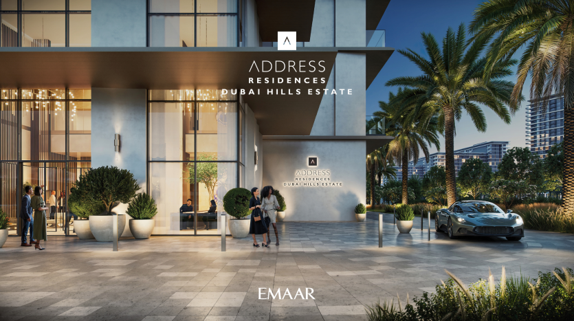 Exterior view of the Address Residences Dubai Hills Estate complex, which features modern architecture with bay windows, lush vegetation and palm trees. A luxury car is parked outside and people are seen walking near the entrance. The Emaar logo is also visible.